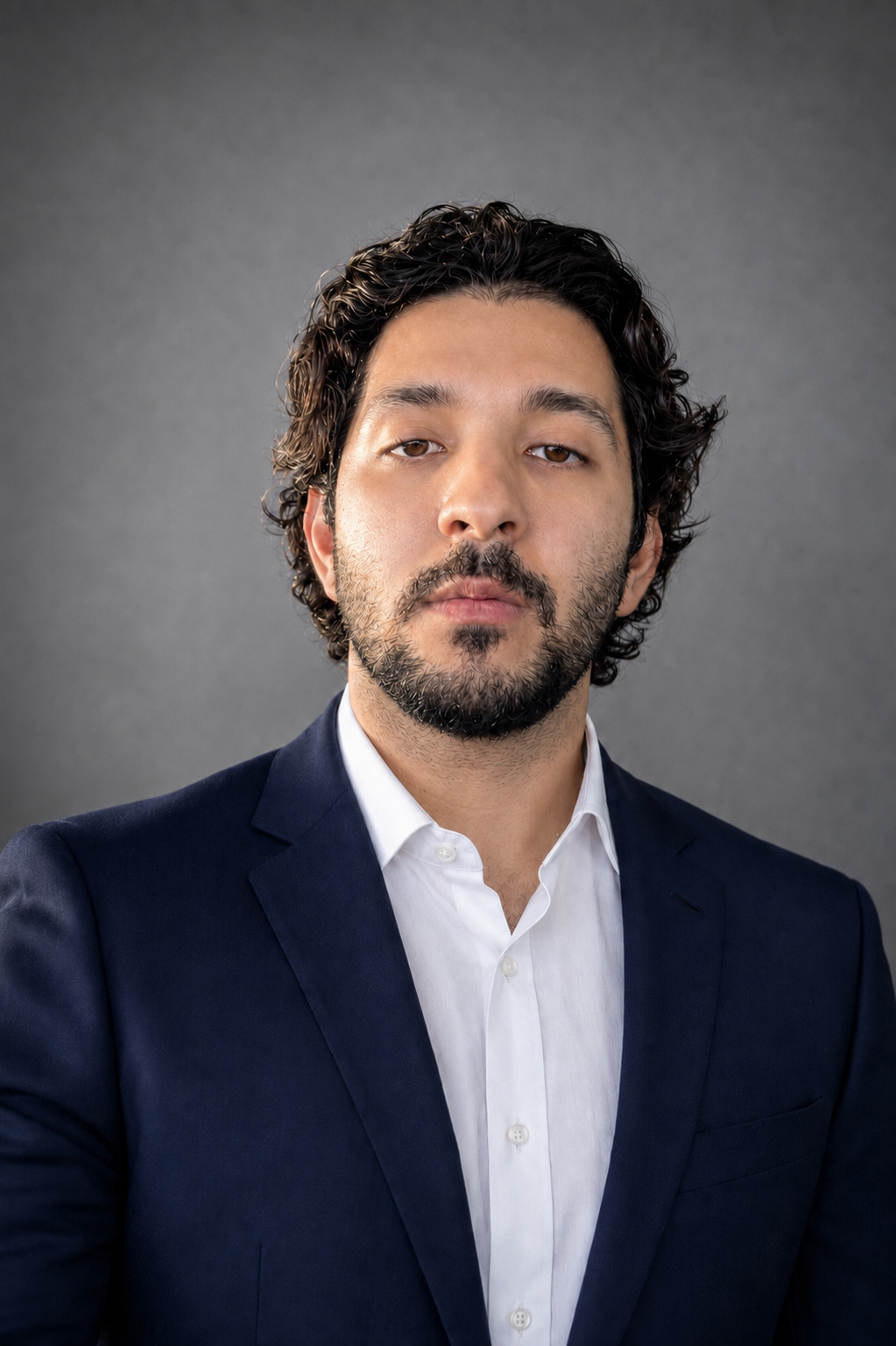 Professional headshot of Radman Tahsildoust